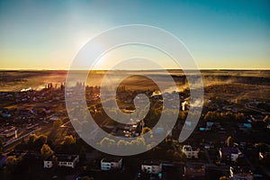 Aerial view of countryside village panorama in autumn sunset