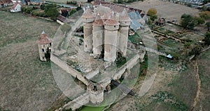 Aerial view of countryside of village of Sarzay with ancient fortified castle Chateau de Sarzay, Indre, France