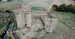 Aerial view of countryside of village of Sarzay with ancient fortified castle Chateau de Sarzay, Indre, France