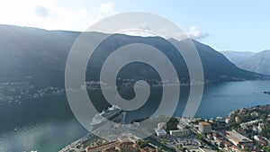 Aerial view of a couple standing on the edge of the old fortress of Kotor