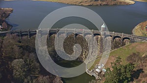 Aerial view of Craig goch elan valley. flying over dam white panning downwards