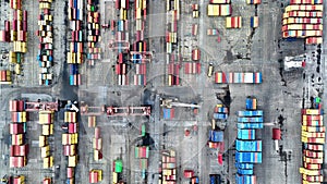 aerial view of cranes and counters loading in port