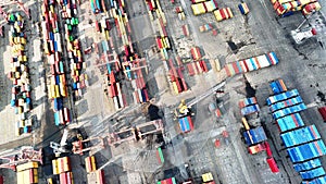 aerial view of cranes and counters loading in port