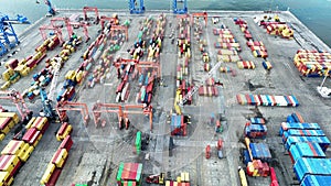 aerial view of cranes and counters loading in port