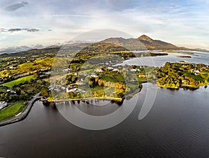 Aerial view of Croagh Patrick mountain and Westport bay at sunrise