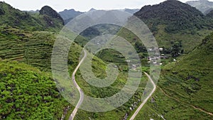 Aerial view of crooked path of road on the mountains in Asia Village