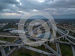 Aerial view of crossing highway roads above Florida during the sunrise