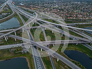 Aerial view of crossing highway roads above Florida during the sunrise