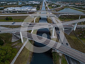 Aerial view of crossing highway roads above Florida during the sunrise