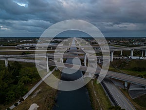 Aerial view of crossing highway roads above Florida during the sunrise