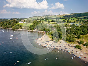 Aerial view of a crowded beach on the shore of a large lake in summer (Ullswater, Lake District, England