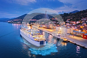 Aerial view of cruise ship at harbor at night