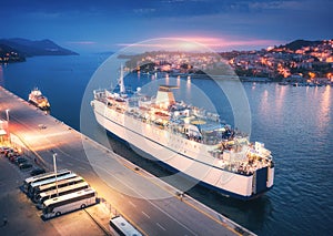 Aerial view of cruise ship at harbor at sunset