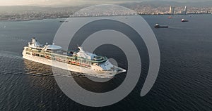 Aerial view of a cruise ship with tourists in the open sea.