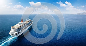 Aerial view of a cruise ship traveling over blue ocean