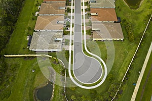 Aerial view of cul-de-sac at neighborhood street dead end with tightly packed homes in Florida closed living clubs