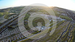 Aerial view of cultivated farmland with gardens and crop fields in rural area