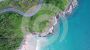 Aerial view of curve road along the seashore at Phuket Thailand beautiful seacoast and open sea in summer season Nature recovered