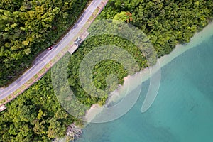 Aerial view of curve road along the seashore at Phuket Thailand beautiful seacoast and open sea in summer season Nature recovered