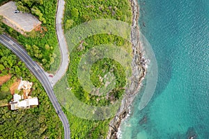 Aerial view of curve road along the seashore at Phuket Thailand beautiful seacoast and open sea in summer season Nature recovered