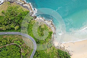 Aerial view of curve road along the seashore at Phuket Thailand beautiful seacoast and open sea in summer season Nature recovered