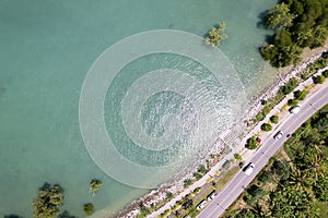 Aerial view of curve road along the seashore at Phuket Thailand beautiful seacoast and open sea in summer season Nature recovered