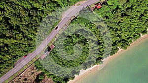 Aerial view of curve road along the seashore at Phuket Thailand beautiful seacoast and open sea in summer season Nature recovered