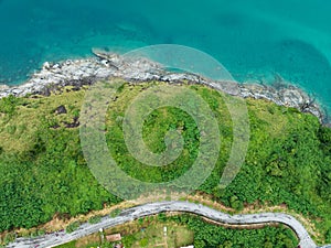 Aerial view of curve road along the seashore at Phuket Thailand beautiful seacoast and open sea in summer season Nature recovered