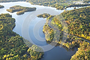 Aerial view of curving road along Mississippi River during autumn
