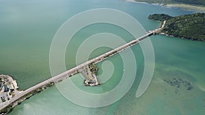 Aerial view at the dam with railroad and vehicular bridge leading through the Skadar lake. Route from Podgorica to