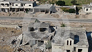 Aerial view of damaged and abandoned buildings in a village