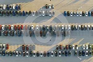 Aerial view of dealership parking lot with many brand new cars for sale. Development of american automotive industry