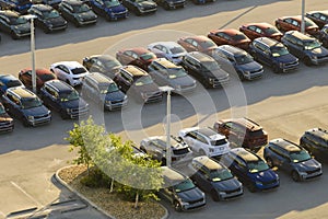 Aerial view of dealership parking lot with many brand new cars for sale. Development of american automotive industry