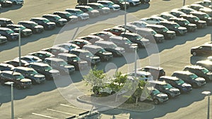 Aerial view of dealership parking lot with many brand new cars for sale. Development of American automotive industry