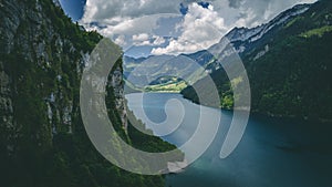 Aerial view of deep blue mountain lake in swiss alps, klontalersee switzerland