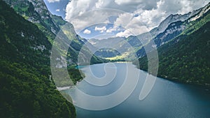 Aerial view of deep blue mountain lake in swiss alps, klontalersee switzerland