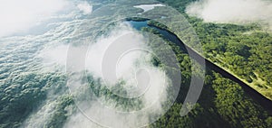 Aerial view of a dense amazonian rainforest with river. photo