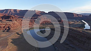 Aerial view of desert, Colorado river in Utah. Scenic nature near the Canyonlands national park, Moab. Sunny morning, sunrise