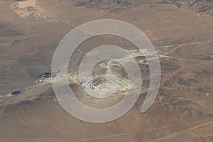 Aerial view of a desert with hills and roads