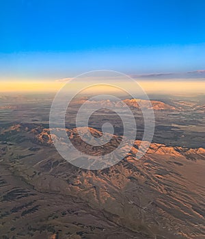 Aerial view of desert with hills and sand dunes somewhere in the Rockies USA