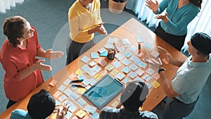Aerial view of developer team discussing and show digital program. Symposium.