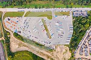 Aerial view of different cars and trucks in parking lot