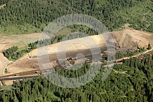 An aerial view of the dikes and terraces at an open pit phosphate mine.