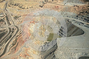 An aerial view of the dikes and terraces at an open pit copper mine. photo