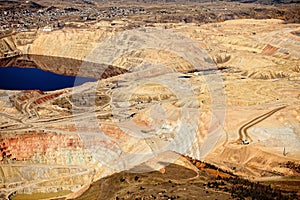 An aerial view of the dikes and terraces at an open pit copper mine. photo