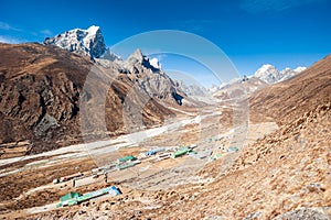 Aerial view of Dingboche village 4410 m and Tawoche/Taboche peak. Trekking in Nepal Himalayas. EBC Everest base camp trek