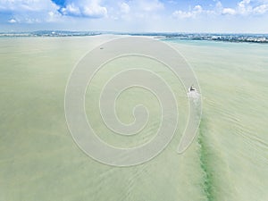 Aerial view of the dirty oily stain and pollution on the coast sea