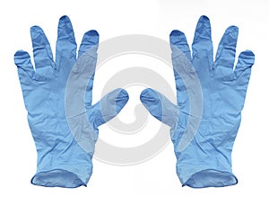 Aerial view of disposable surgical gloves in blue latex, thin to the touch and resistant isolated on white background. Protection