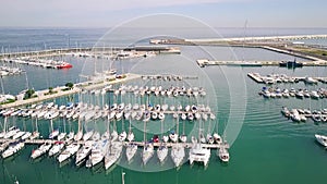 Aerial view of docked sailboats at marina