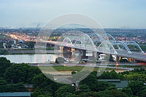 Aerial view of Tru bridge crossing Red River at twilight in Hanoi, Vietnam photo